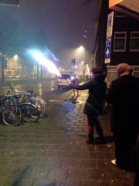 Random person setting off a firework (and someone one else with one in the background)