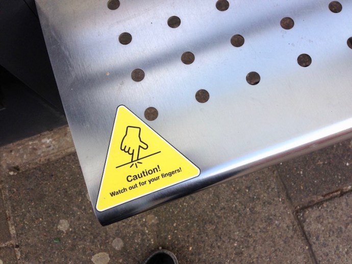 Holes in the bus and tram shelter benches in The Hague
